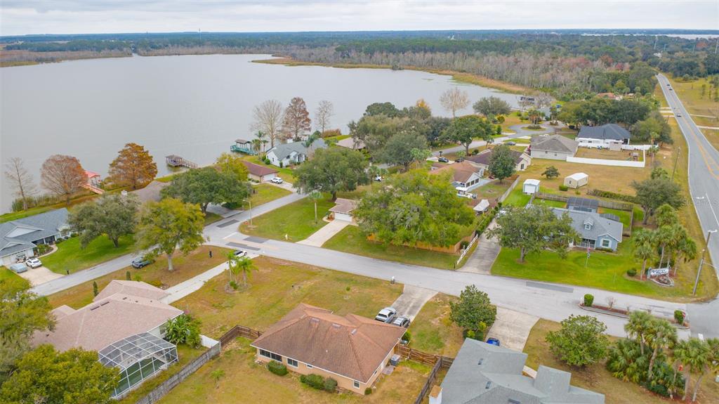 14334 Raintree Boulevard Grand Island, FL 32735 - Photo 39 of 40 an aerial view of a house with a lake view