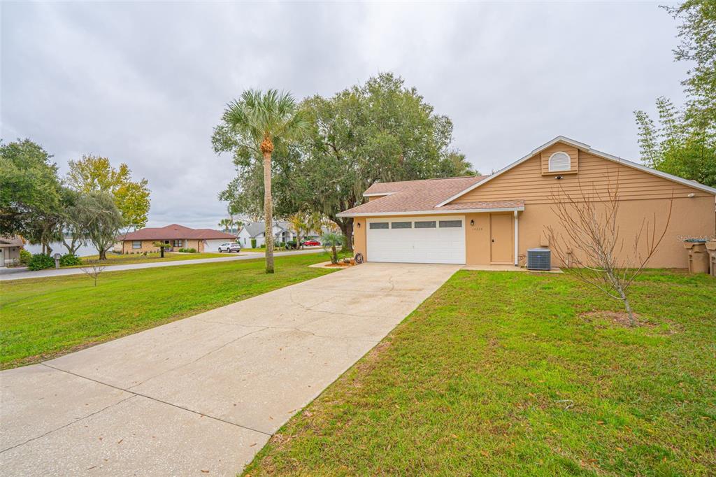 14334 Raintree Boulevard Grand Island, FL 32735 - Photo 6 of 40 a view of outdoor space yard and house