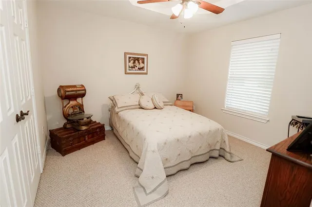 a bedroom with a bed and a dresser