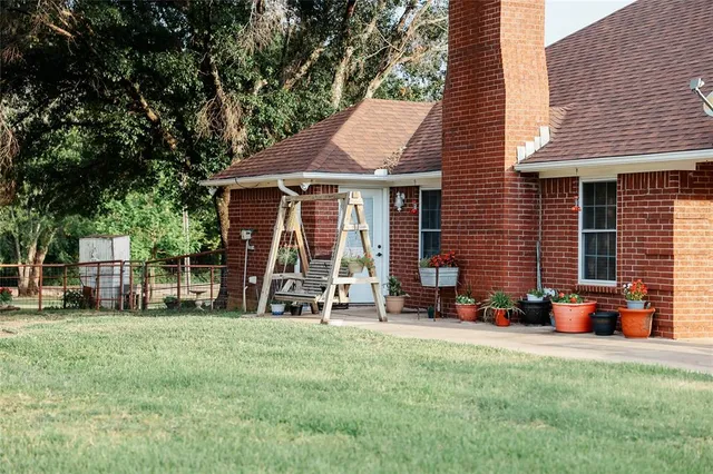 a front view of a house with yard porch and green space