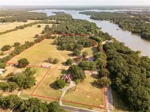 a view of house with backyard and sitting area