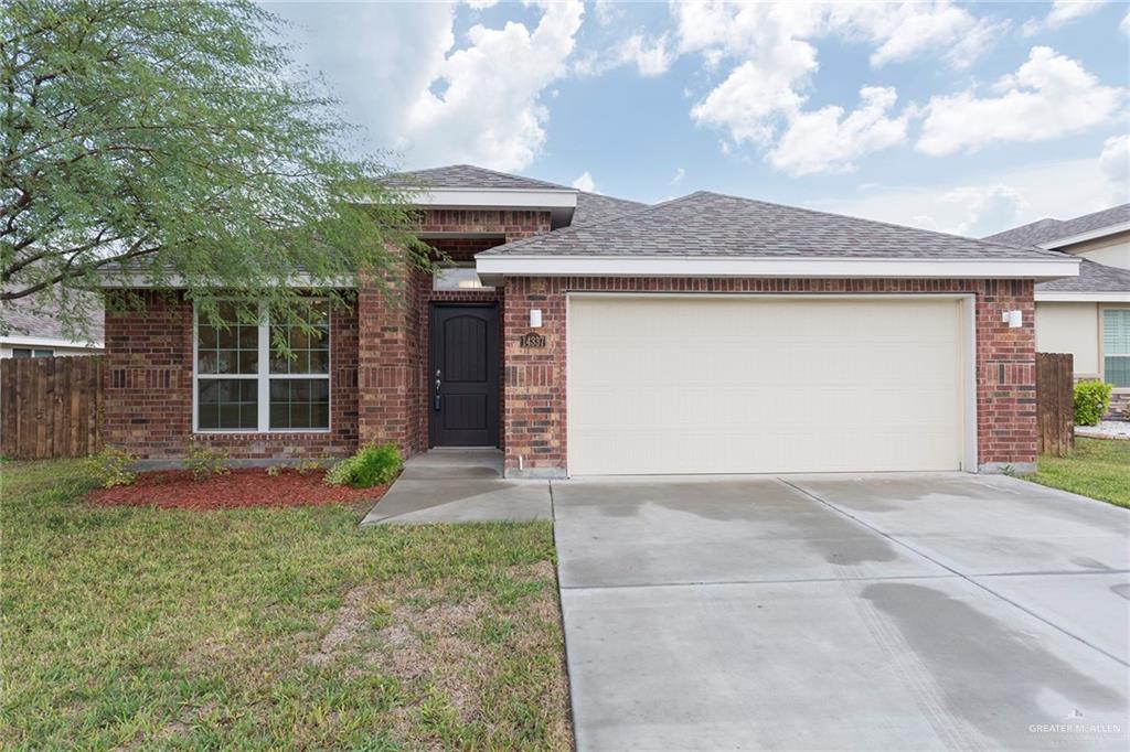 Charming brick exterior with great curb appeal, a two-car garage and a welcoming front entry