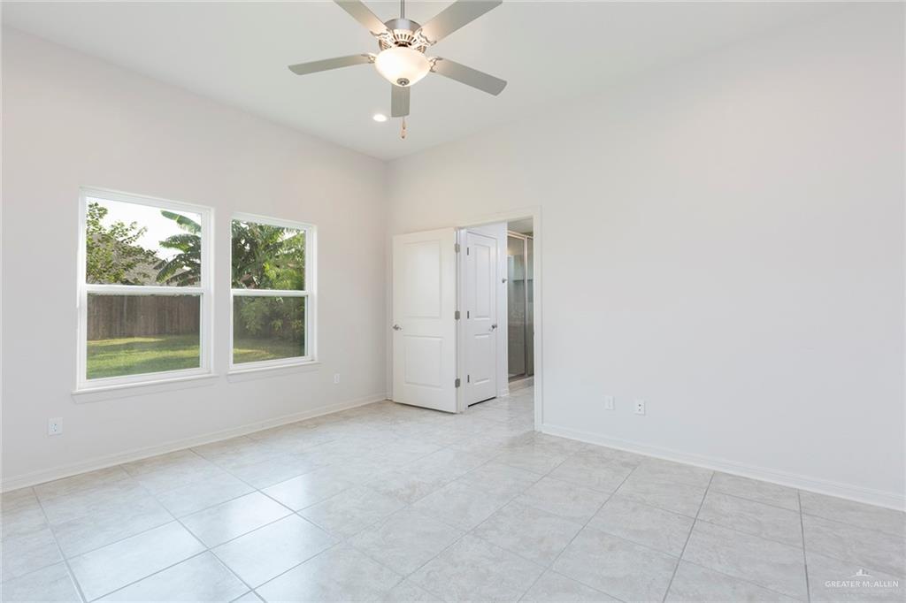 14337 Chalk Rdg Drive McAllen, TX 78504 - Photo 11 of 21 Spacious primary bedroom with high ceilings, natural light and direct access to a private ensuite bath