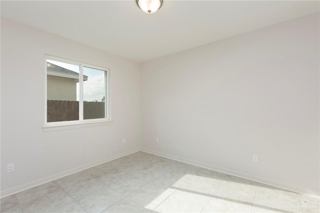 14337 Chalk Rdg Drive McAllen, TX 78504 - Photo 14 of 21 Bright secondary bedroom with natural light, neutral tones and a flexible layout for any use