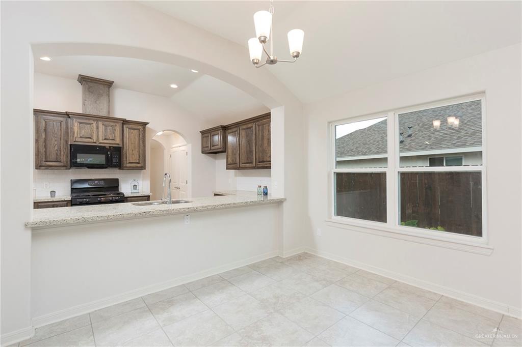 14337 Chalk Rdg Drive McAllen, TX 78504 - Photo 7 of 21 Bright dining area with an open view to the kitchen and plenty of natural light from large windows