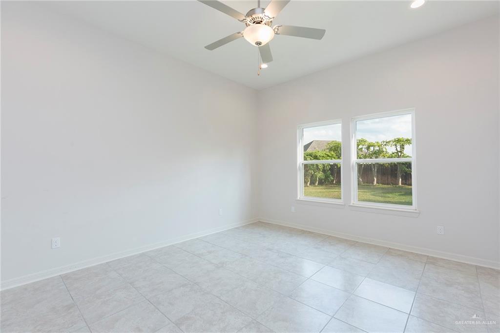 14337 Chalk Rdg Drive McAllen, TX 78504 - Photo 10 of 21 Bright and versatile room with high ceilings, ceiling fan and natural light—perfect as a bedroom, office or flex space