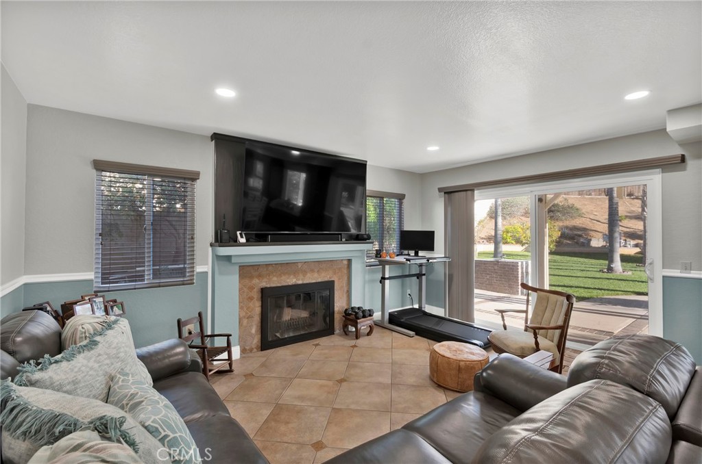 3350 May Court Riverside, CA 92503 - Photo 33 of 55 a living room with furniture a flat screen tv and a fireplace