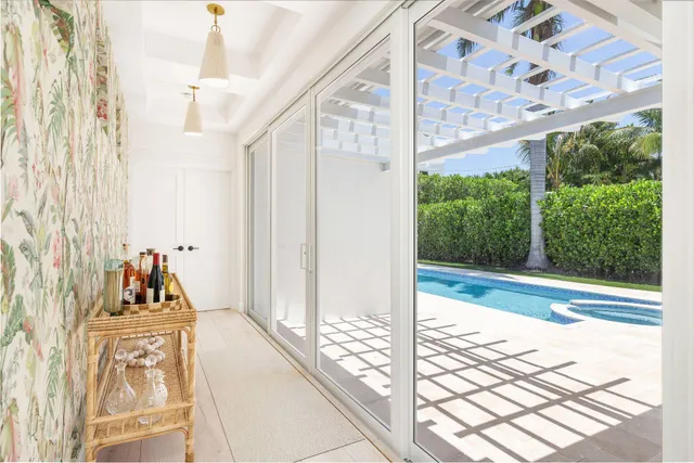 a very nice looking room with a large window and chandelier