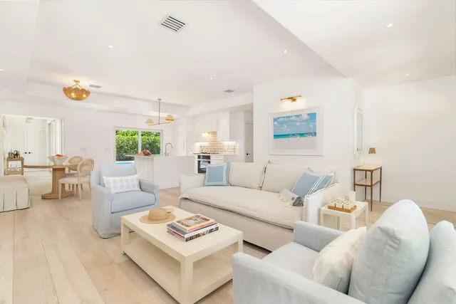 a living room with furniture and a table