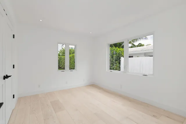 a bathroom with a toilet a sink a vanity and mirror
