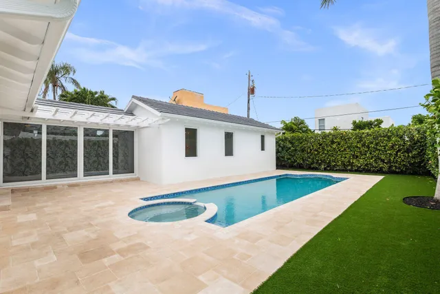 a view of swimming pool with a yard