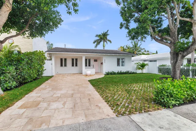 front view of a house with a garden