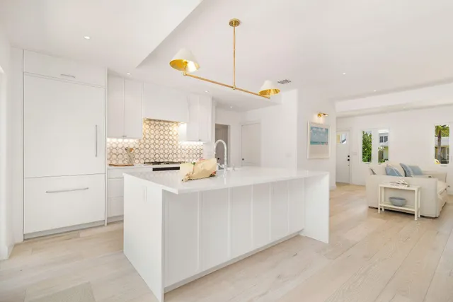 a view of living room with furniture and wooden floor
