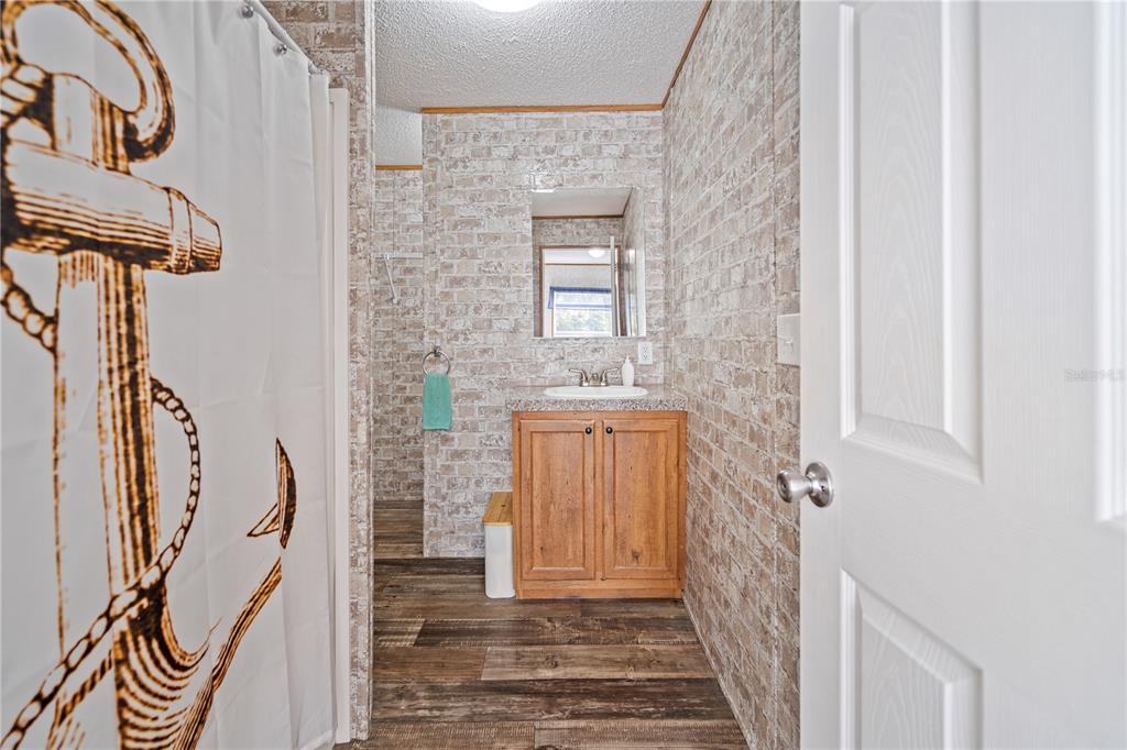10811 Northeast 57th Street Bronson, FL 32621 - Photo 10 of 21 a view of a door with wooden floor and door