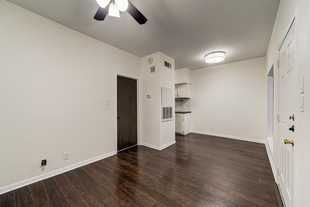 3316 Guadalupe Street, Unit 219 Austin, TX 78705 - Photo 12 of 13 wooden floor in an empty room with a window