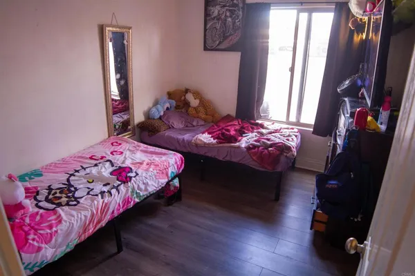 a bedroom with bed and a window