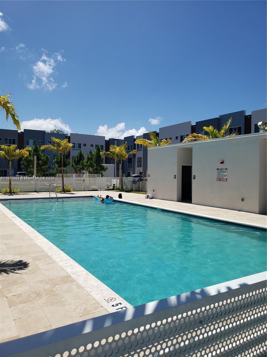 Ojus Miami, FL 33180 - Photo 13 of 13 a view of a big yard with palm trees