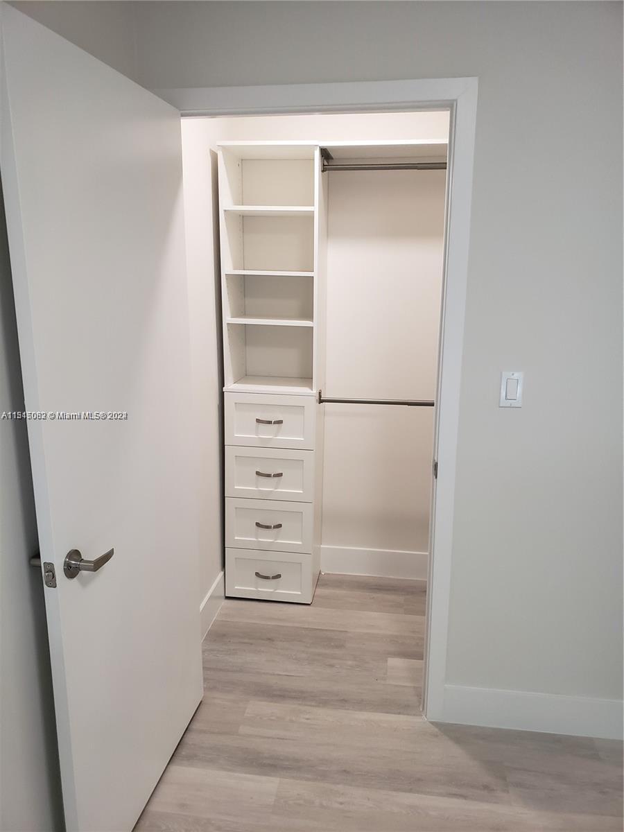 Ojus Miami, FL 33180 - Photo 5 of 13 a view of walk in closet with empty racks