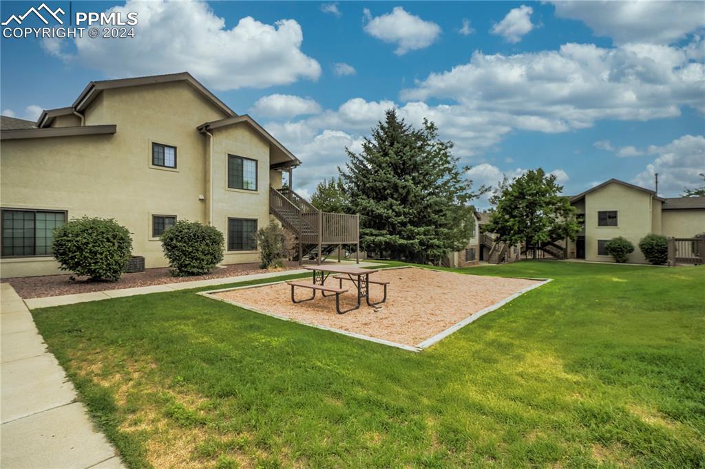 2195 Alicia Point, Unit 102 Colorado Springs, CO 80919 - Photo 28 of 36 a view of backyard of a house with a patio