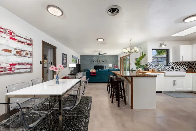 a kitchen with stainless steel appliances a stove and a microwave