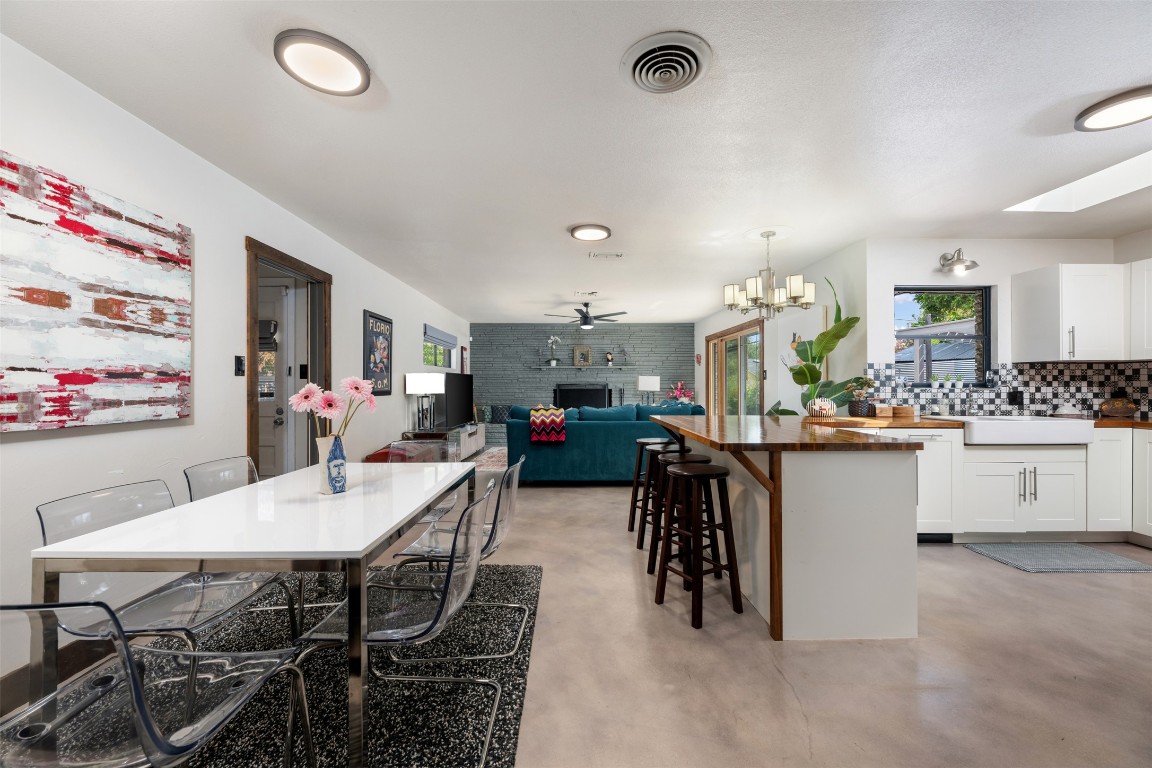 1806 Rogge Lane Austin, TX 78723 - Photo 11 of 40 a kitchen with a table and chairs in it