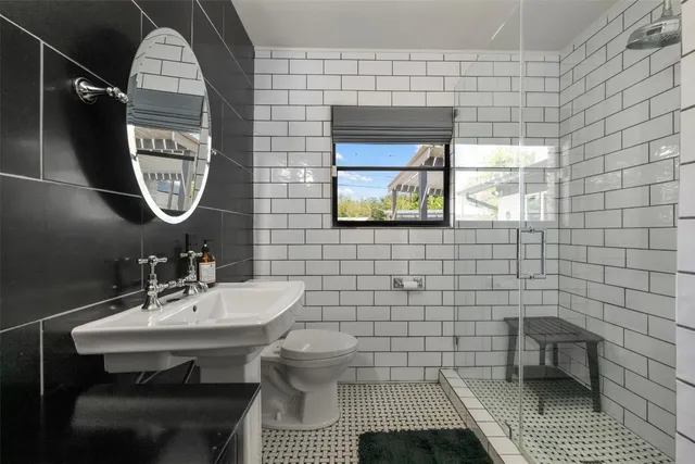 a white bath tub sitting in a bathroom