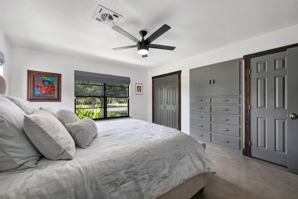 1806 Rogge Lane Austin, TX 78723 - Photo 24 of 40 a bed room with a bed and a window