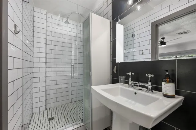 a utility room with cabinets washer and dryer