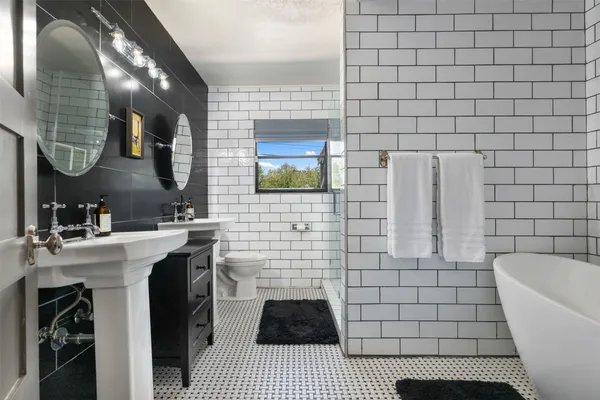 a bedroom with furniture and a wooden floor
