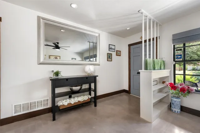 a bed room with furniture and wooden floor