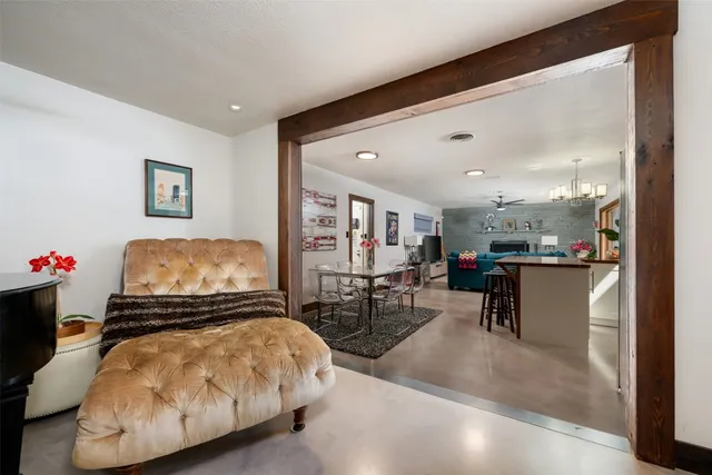 a dining room with furniture and wooden floor