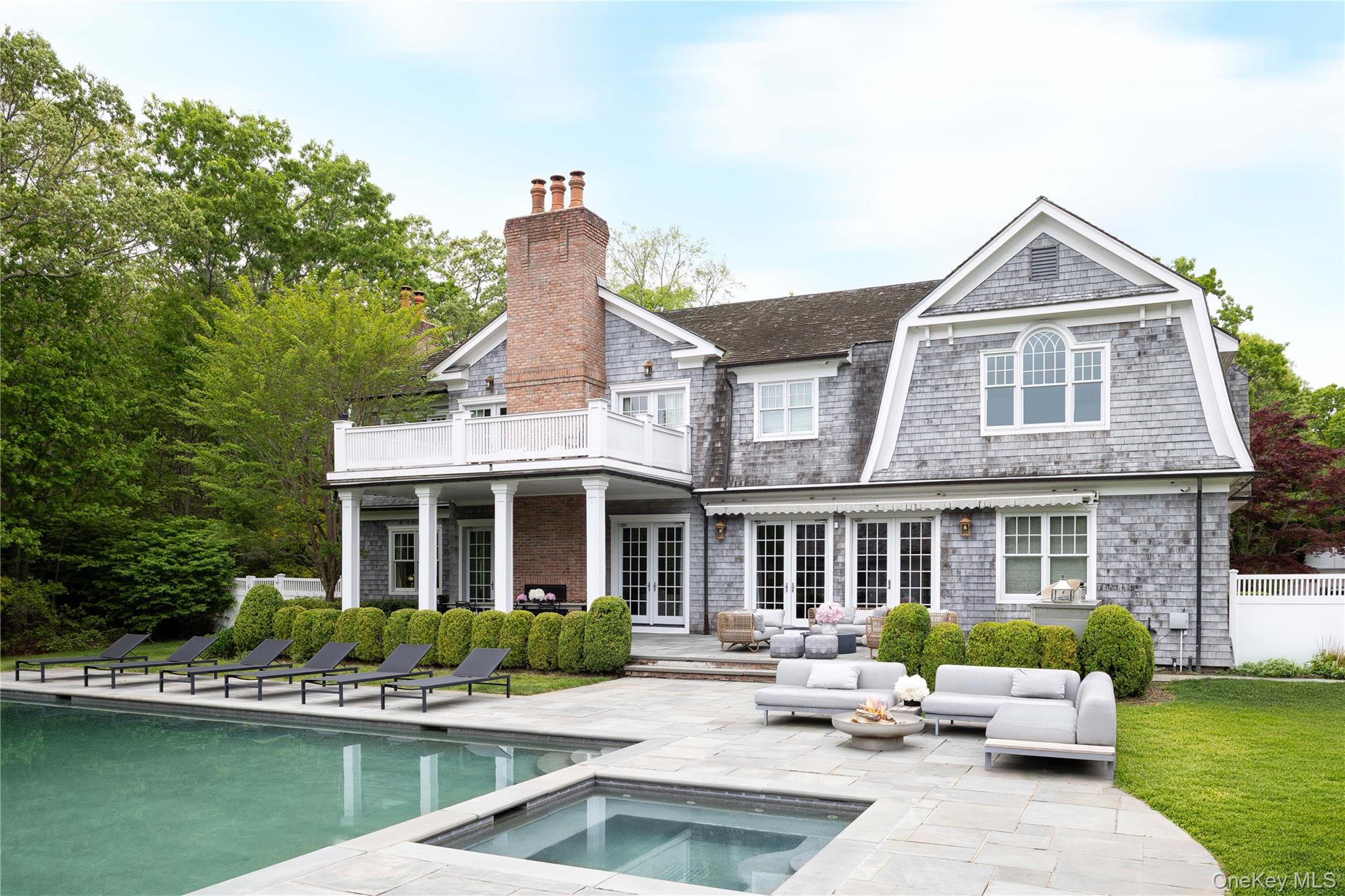 486 Middle Line Highway Bridgehampton, NY 11976 - Photo 24 of 25 a front view of a house with garden space and swimming pool
