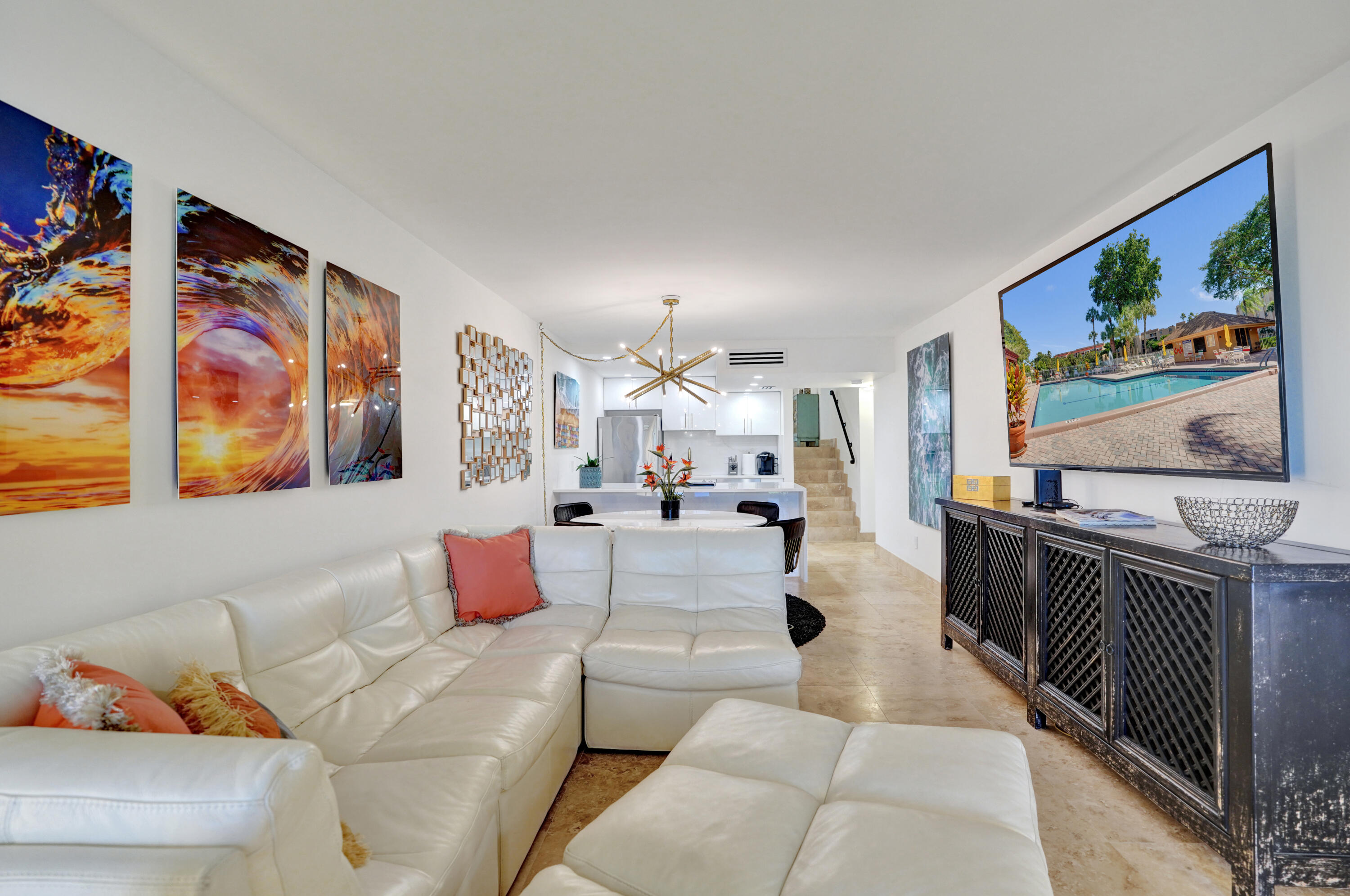 755 Dotterel Road, Unit 1112 Delray Beach, FL 33444 - Photo 14 of 64 a living room with furniture and painting on the wall