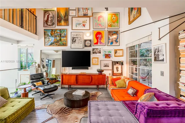 a living room with furniture a rug and a window