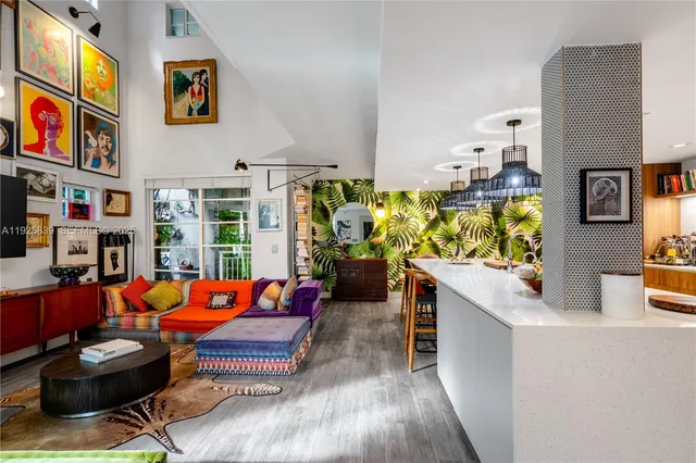 a living room filled with furniture window and book shelf