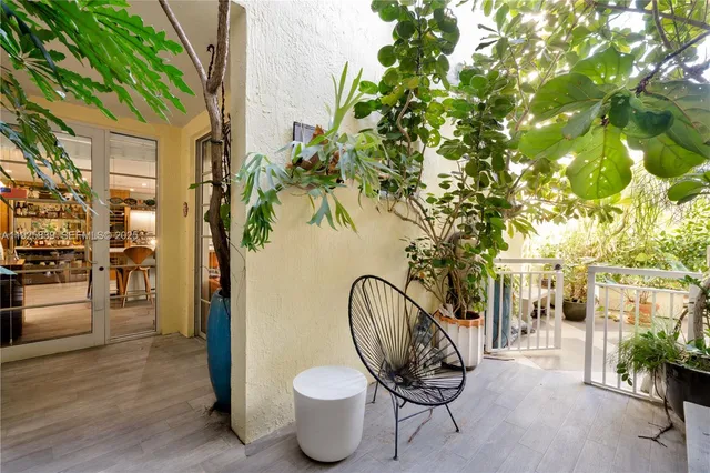 a view of a porch with seating space