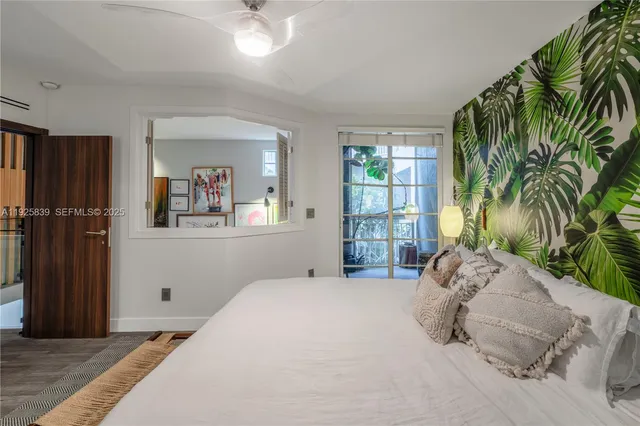 a bathroom with a tub shower sink and mirror