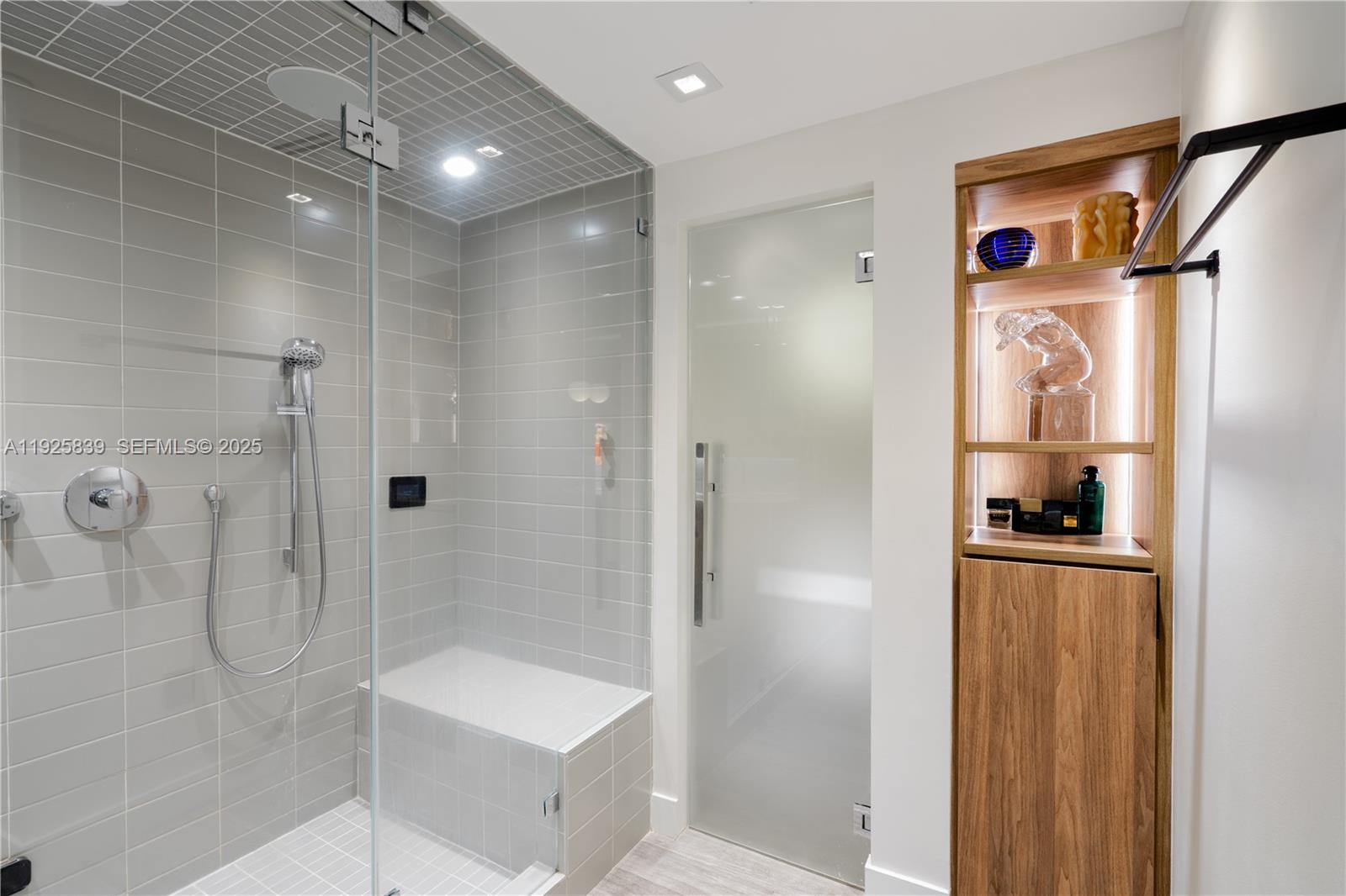 125 Jefferson Avenue, Unit 119 Miami Beach, FL 33139 - Photo 23 of 47 a bathroom with a tub shower sink and mirror