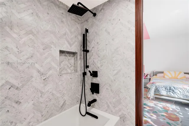 a bedroom with furniture and a walk in closet