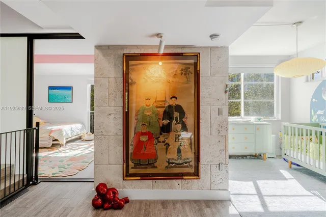 a living room with furniture a rug and a painting on the wall