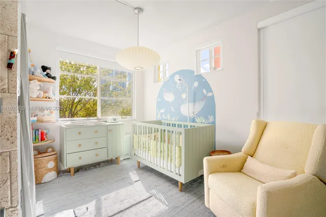 a bedroom with a bed and a mirror