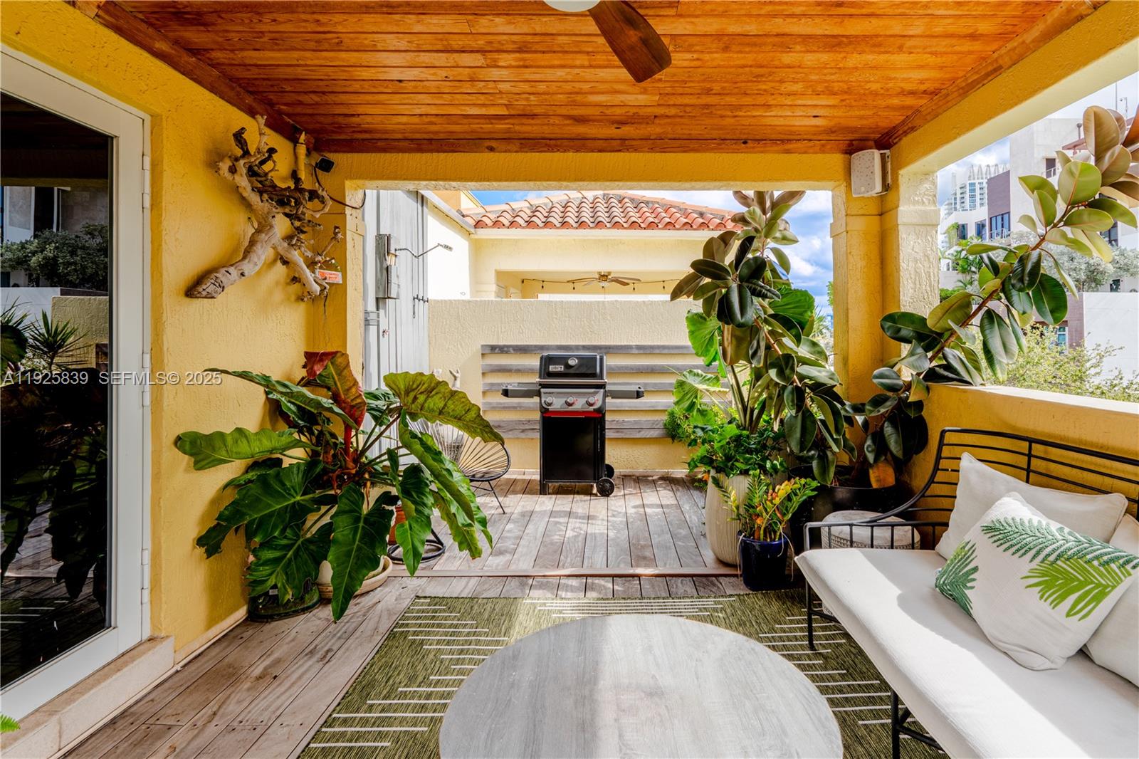 125 Jefferson Avenue, Unit 119 Miami Beach, FL 33139 - Photo 36 of 47 a living room with furniture a potted plant and a fireplace