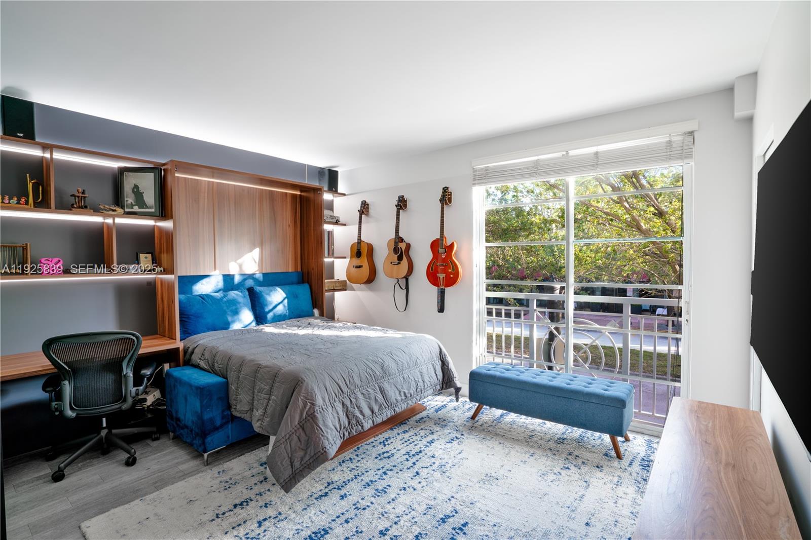 125 Jefferson Avenue, Unit 119 Miami Beach, FL 33139 - Photo 6 of 47 a bedroom with a bed and a large window