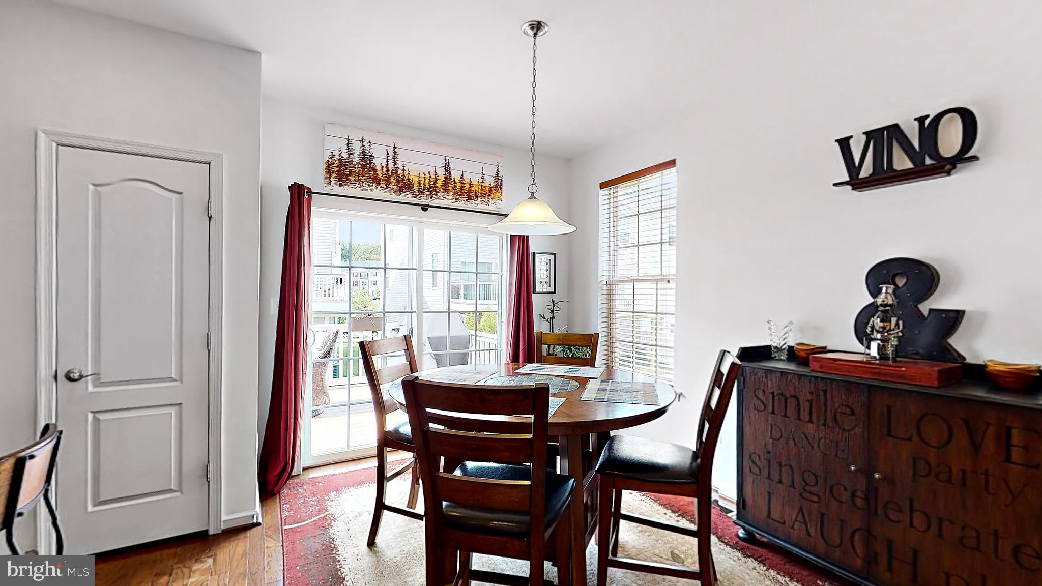 912 Sandy Run Road Baltimore, MD 21220 - Photo 22 of 64 Dining with glass slider and main level deck entry