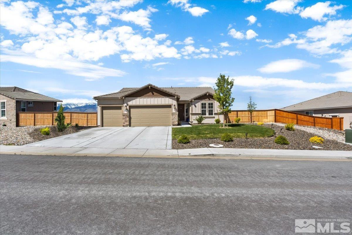 10385 Alchemy Court Reno, NV 89521 - Photo 1 of 40 a front view of a house with a yard and garage
