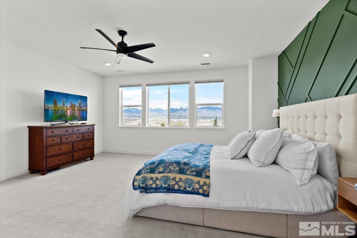10385 Alchemy Court Reno, NV 89521 - Photo 14 of 40 a bedroom with a bed dresser and a window