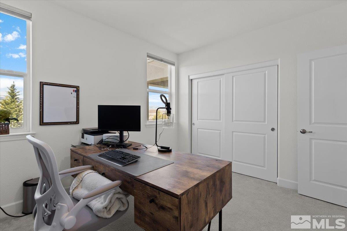 10385 Alchemy Court Reno, NV 89521 - Photo 21 of 40 a room with furniture and a desk