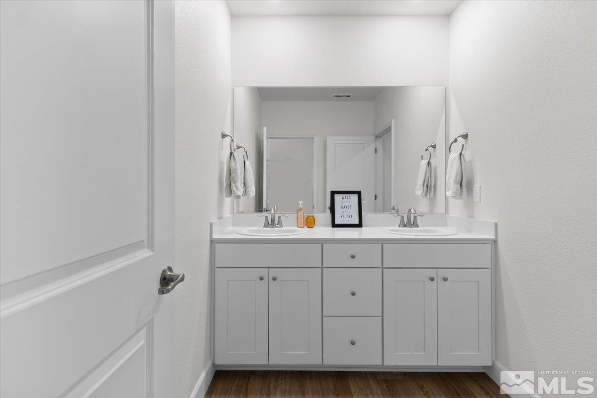 10385 Alchemy Court Reno, NV 89521 - Photo 22 of 40 a bathroom with a sink and a mirror