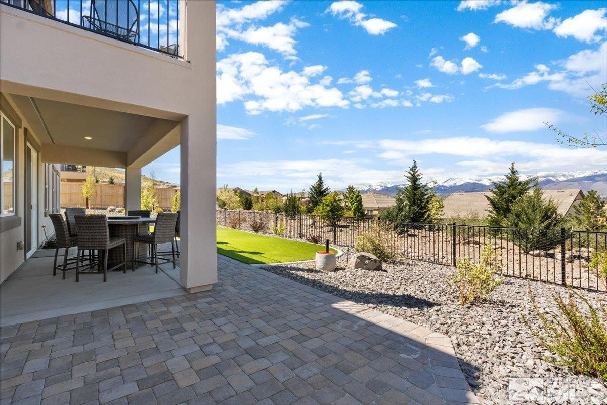 10385 Alchemy Court Reno, NV 89521 - Photo 30 of 40 a view of a swimming pool with lawn chairs