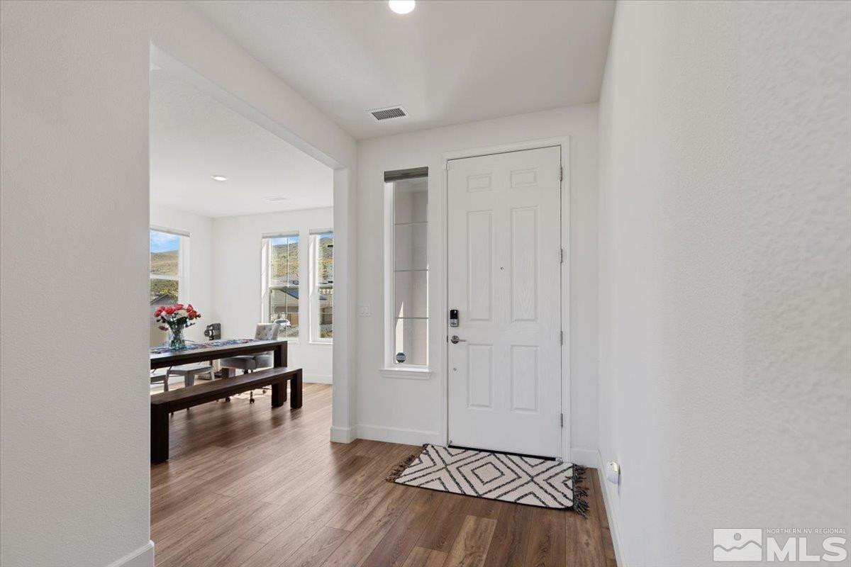 10385 Alchemy Court Reno, NV 89521 - Photo 3 of 40 a view of a livingroom with furniture and hardwood floor